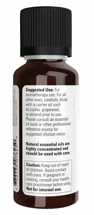 Brown glass bottle of tea tree essential oil with black cap and usage instructions label.