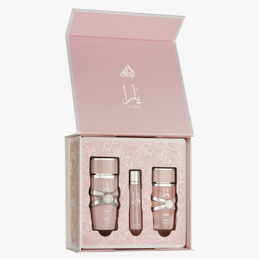 Elegant pink YARA gift set with three luxury skincare bottles in floral-patterned box