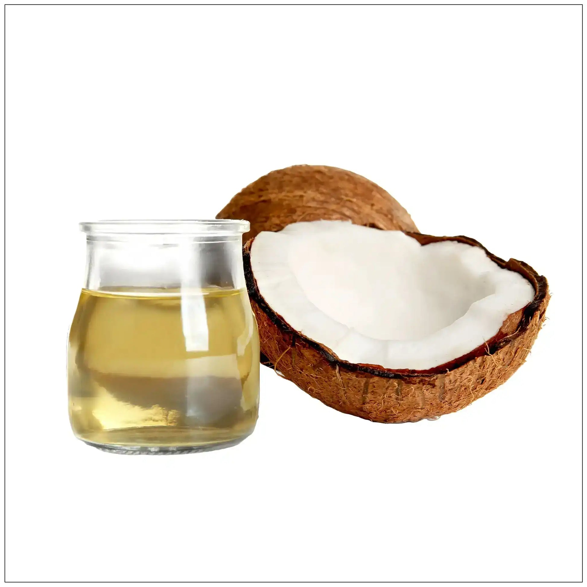 Glass jar of clear coconut oil next to a halved coconut with white flesh on white background