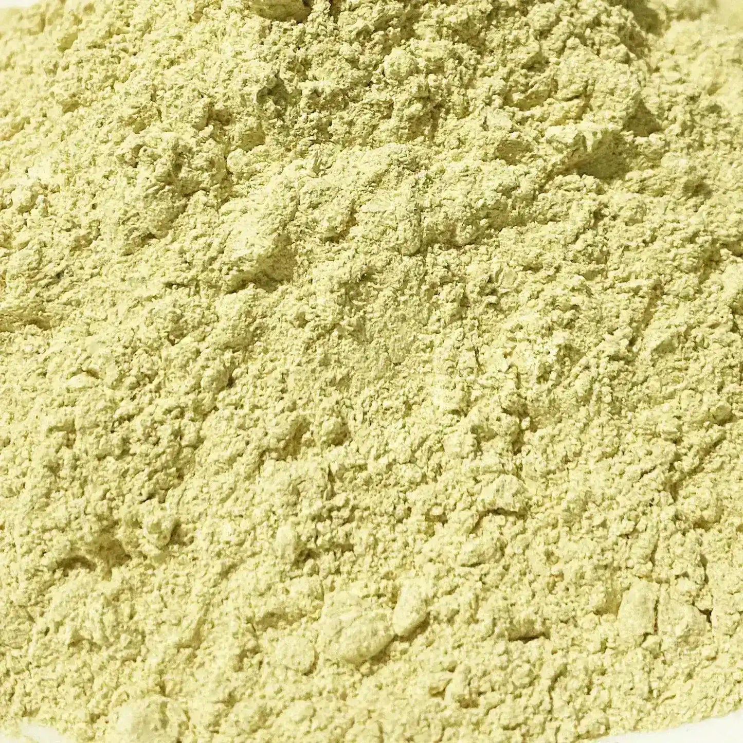 Close-up of light yellow powdered turmeric spice with fine texture
