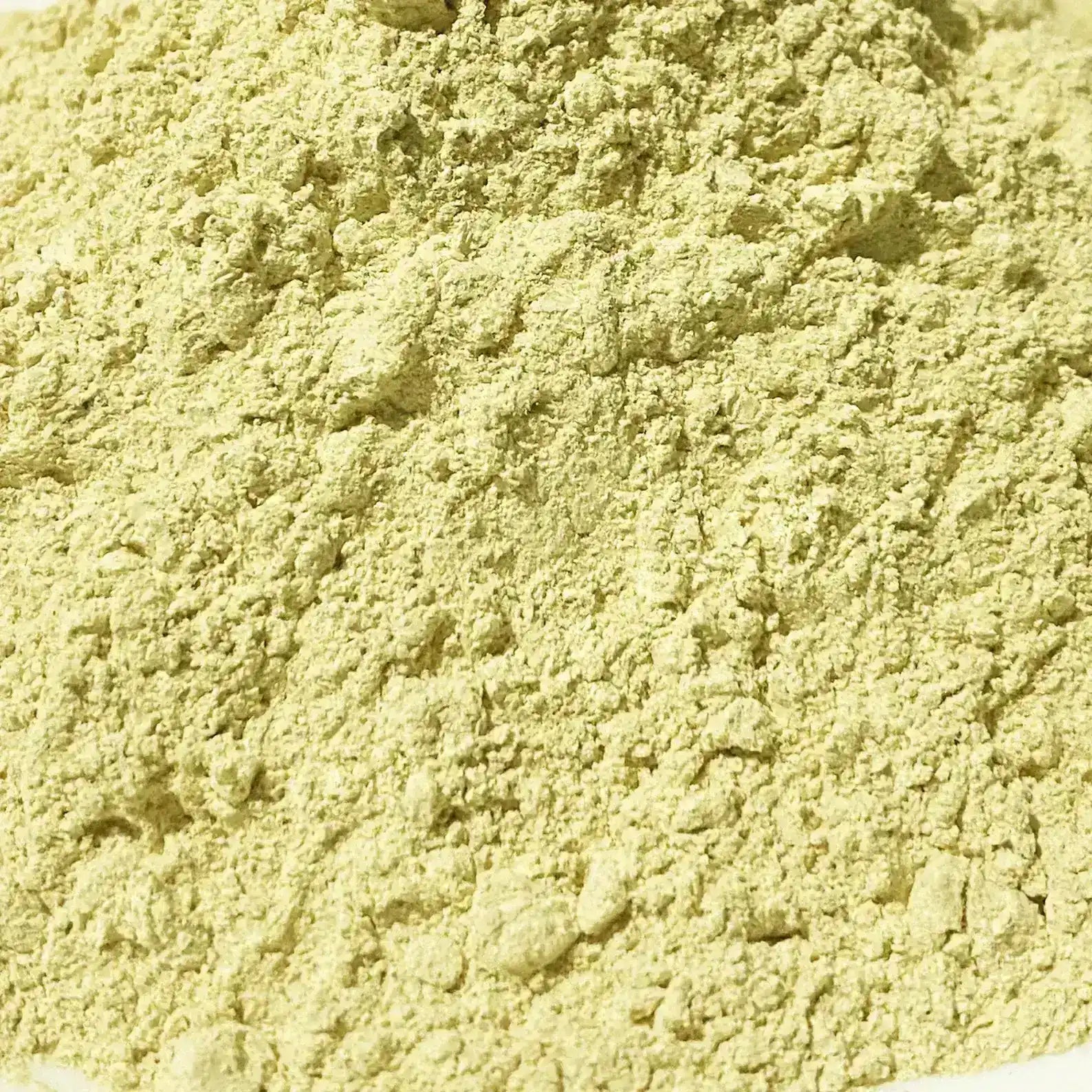 Close-up of light yellow powdered turmeric spice with fine texture