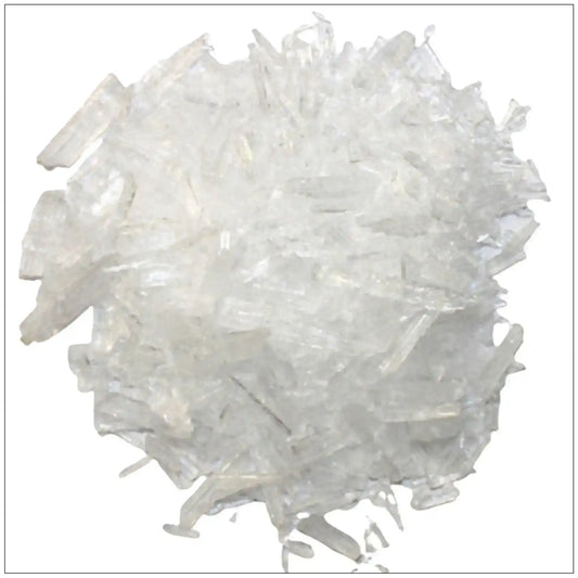 Close-up of transparent menthol crystals cluster on white background