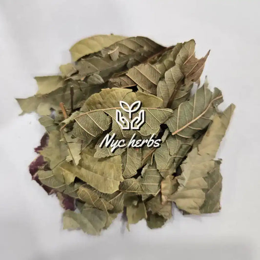 Pile of dried green herb leaves on a white background with NYC Herbs logo overlay